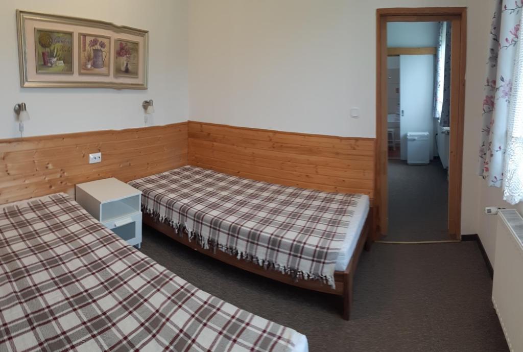 Postel nebo postele na pokoji v ubytování Volenter Gästehaus