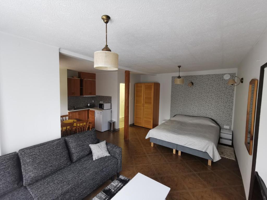 Posteľ alebo postele v izbe v ubytovaní Apartament Ogrodowa