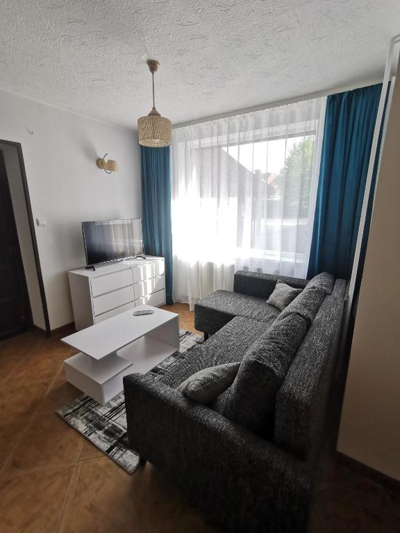 Posteľ alebo postele v izbe v ubytovaní Apartament Ogrodowa