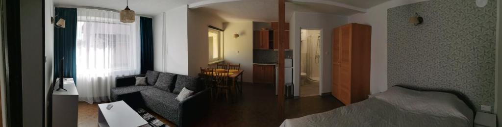 Posteľ alebo postele v izbe v ubytovaní Apartament Ogrodowa