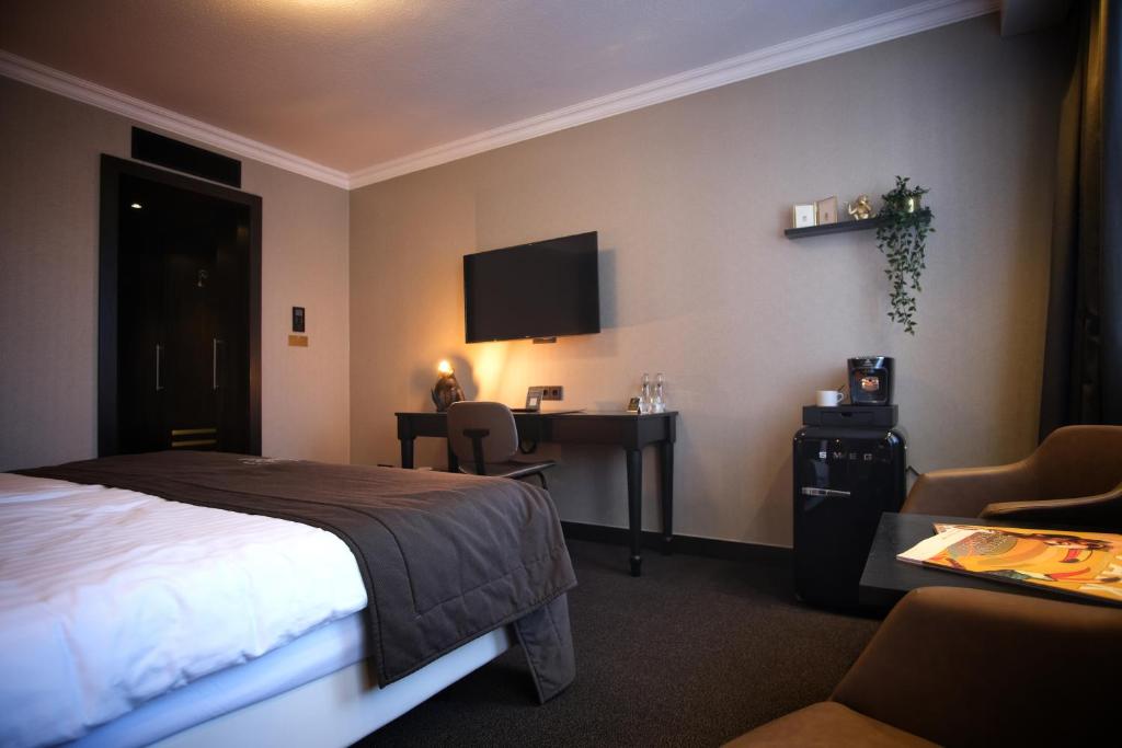 Postel nebo postele na pokoji v ubytování Van der Valk Hotel Hildesheim
