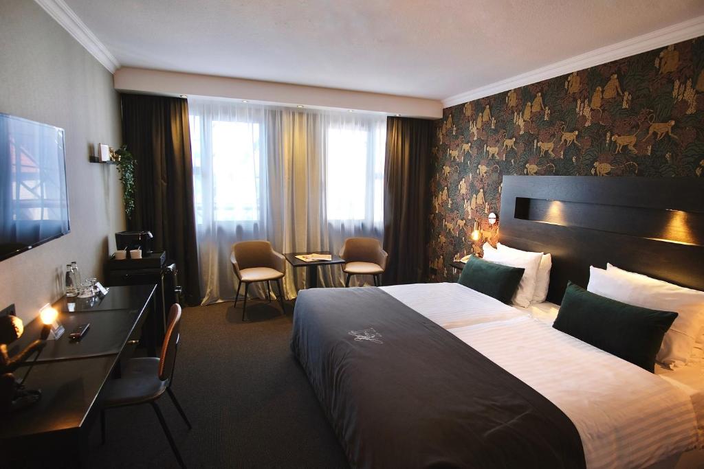 Postel nebo postele na pokoji v ubytování Van der Valk Hotel Hildesheim