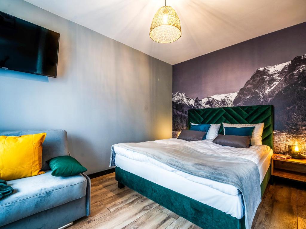 Posteľ alebo postele v izbe v ubytovaní Apartamenty Tatrzańskie Doliny