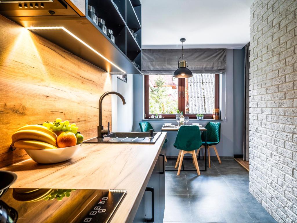 Kuchyňa alebo kuchynka v ubytovaní Apartamenty Tatrzańskie Doliny