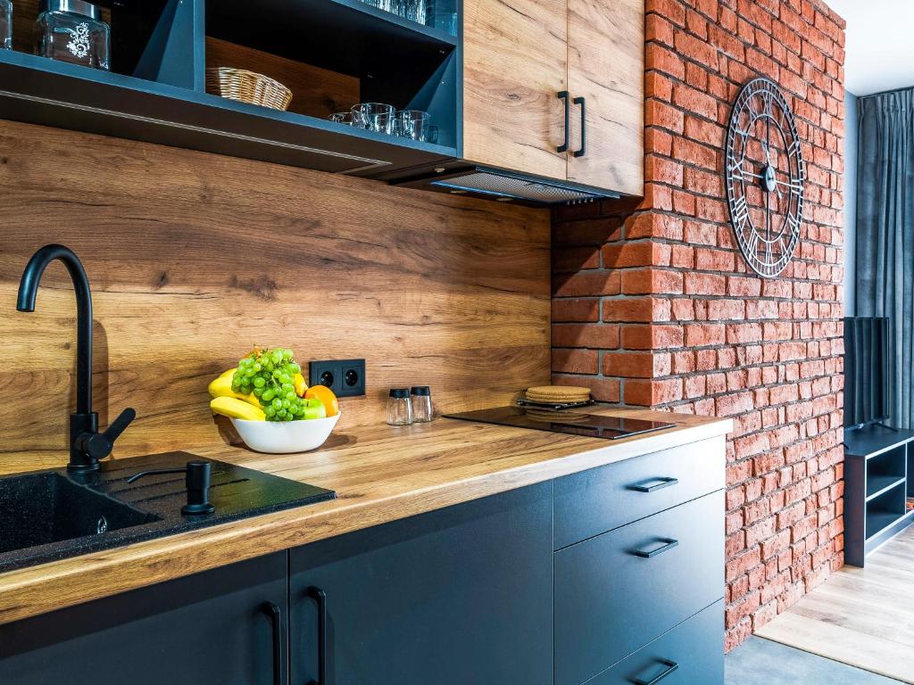 Kuchyňa alebo kuchynka v ubytovaní Apartamenty Tatrzańskie Doliny