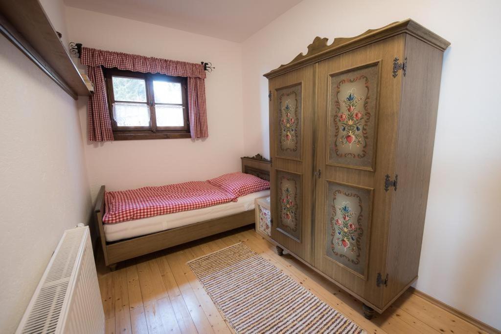 A bed or beds in a room at Almhaus Anita