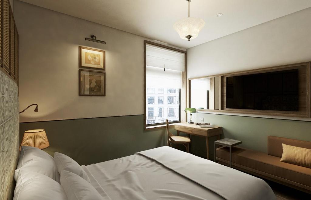 Postel nebo postele na pokoji v ubytování La Passion Hanoi Hotel & Spa