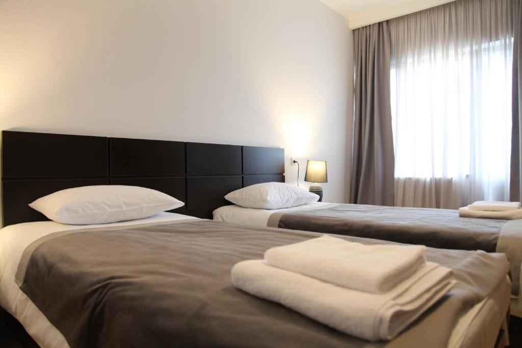 Letto o letti in una camera di Hotel Chubu