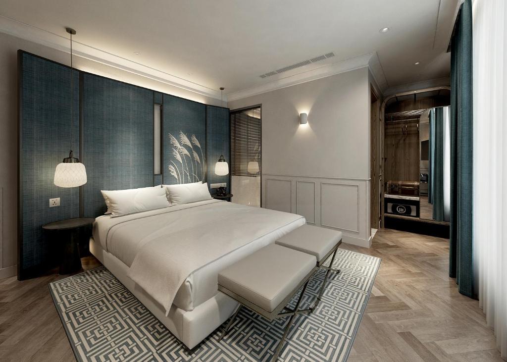 Postel nebo postele na pokoji v ubytování La Passion Hanoi Hotel & Spa