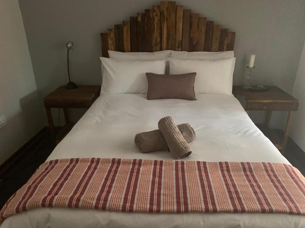 Кровать или кровати в номере Cycad Stay