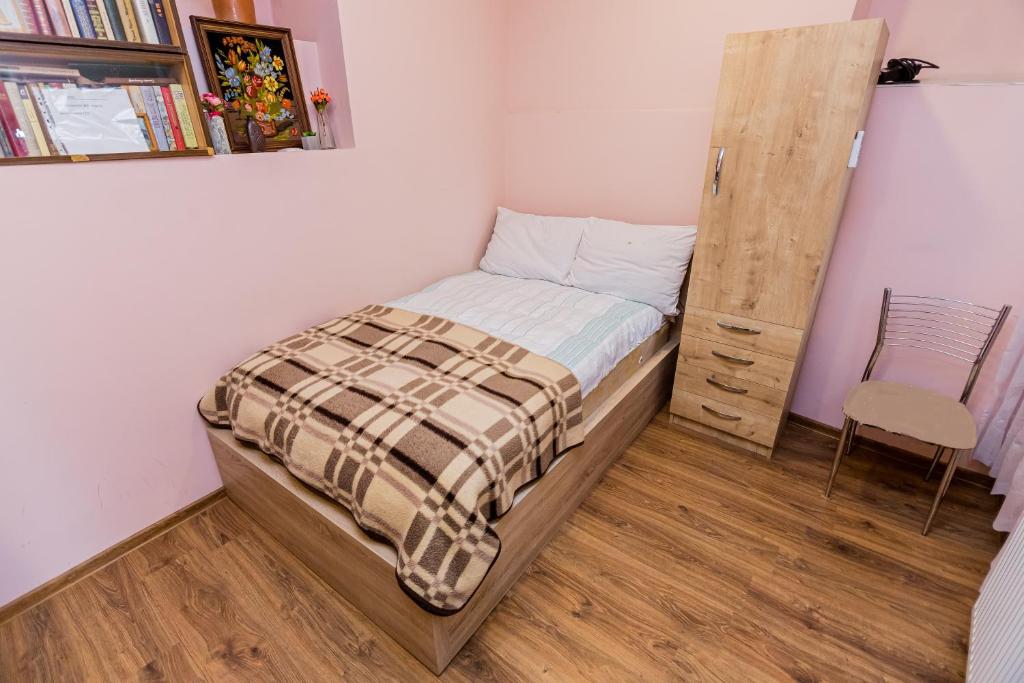 Postel nebo postele na pokoji v ubytování Anzori House