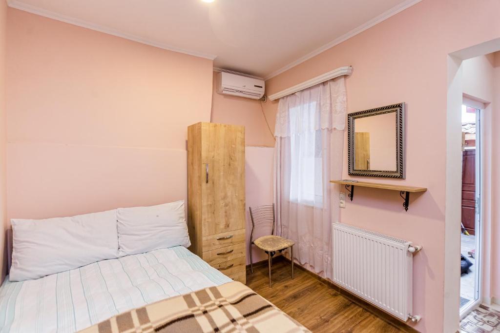 Postel nebo postele na pokoji v ubytování Anzori House