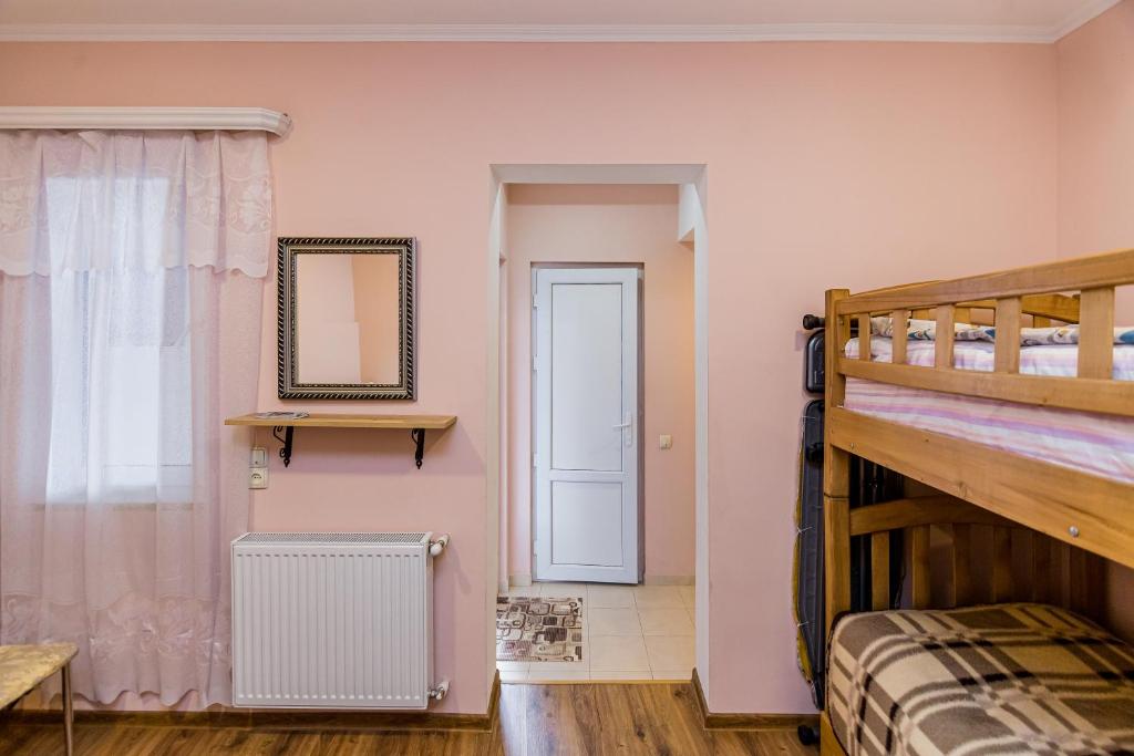 Postel nebo postele na pokoji v ubytování Anzori House