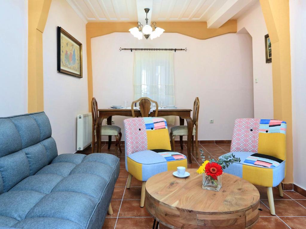 a living room with a couch and a table at Achi's House in Lefkada