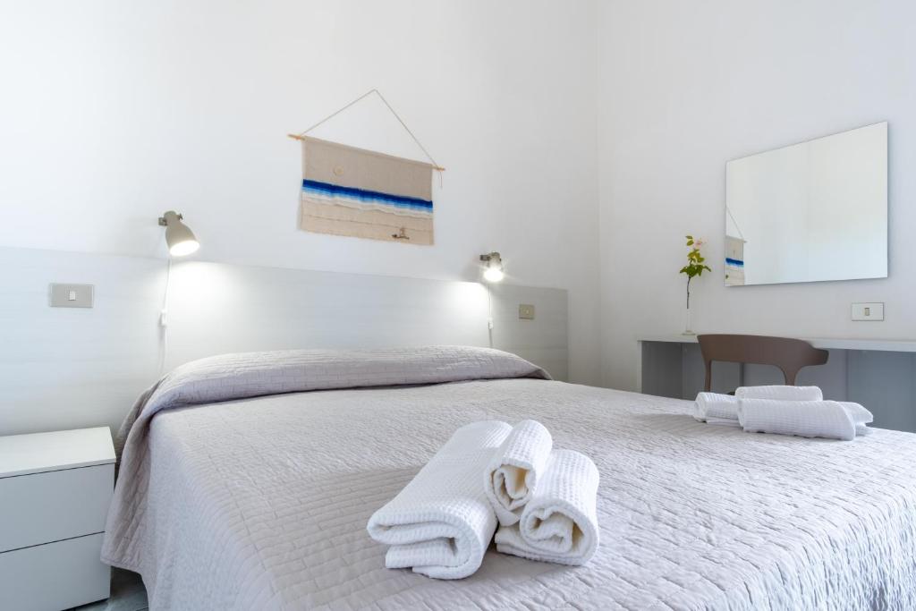 Łóżko lub łóżka w pokoju w obiekcie Residence Cort'e Accas
