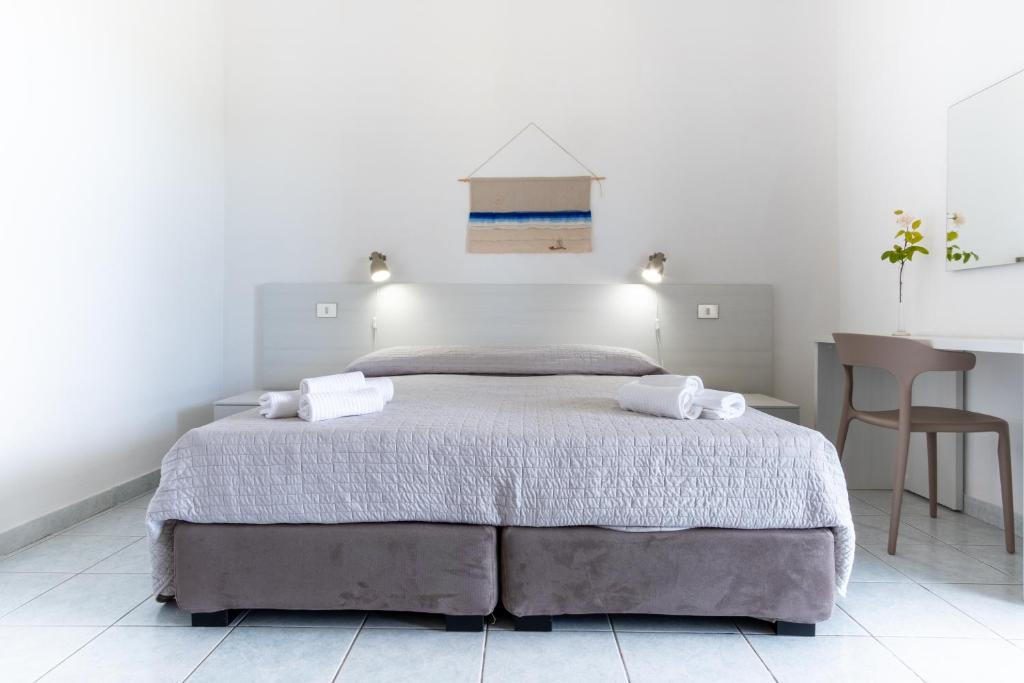 Łóżko lub łóżka w pokoju w obiekcie Residence Cort'e Accas