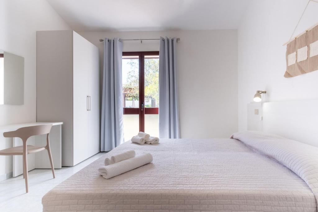 Łóżko lub łóżka w pokoju w obiekcie Residence Cort'e Accas