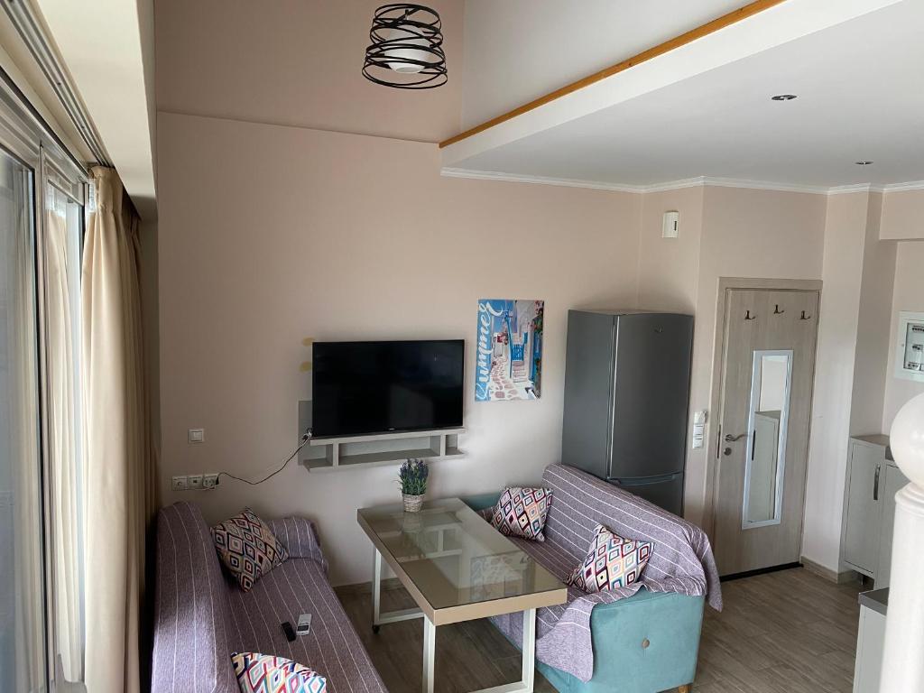 Telewizja i/lub zestaw kina domowego w obiekcie Ola Kala Apartments and Rooms
