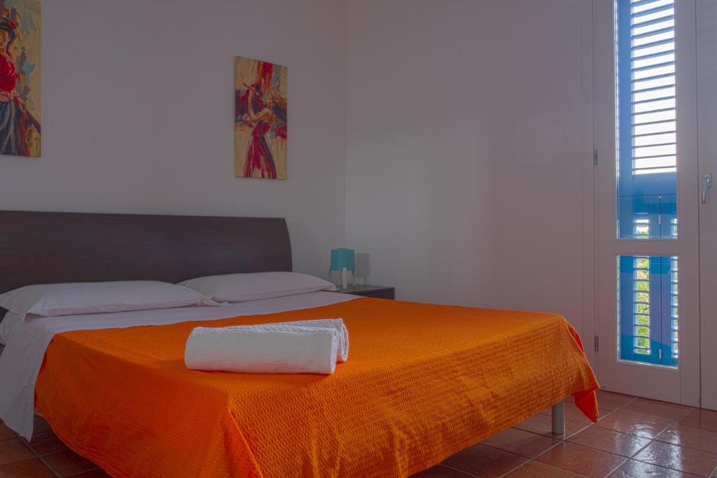 Postel nebo postele na pokoji v ubytování Orsola Apartments