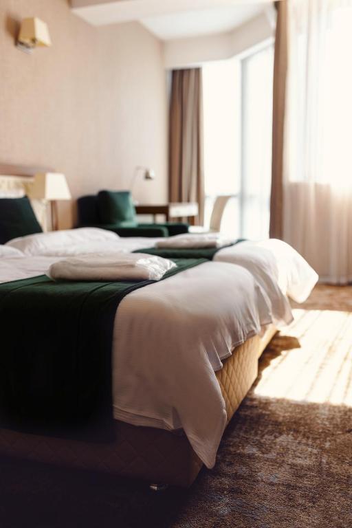 Postel nebo postele na pokoji v ubytování Costé Hotel