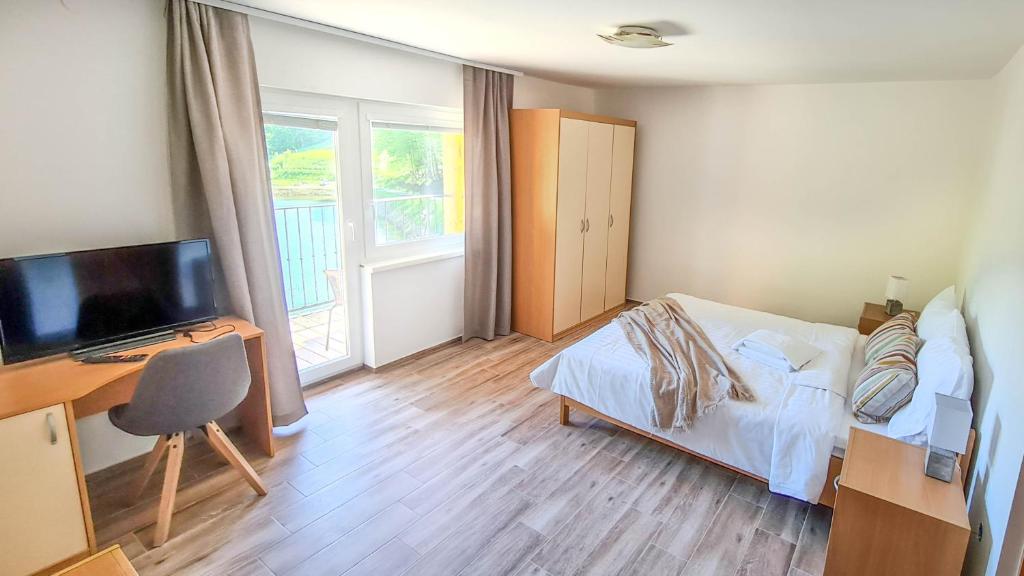 Postel nebo postele na pokoji v ubytování Zelena Oaza