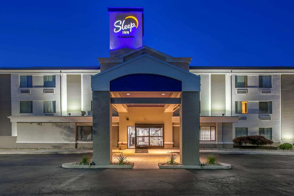 a hotel with a sign on the front of it at Sleep Inn Allentown-Fogelsville in Allentown