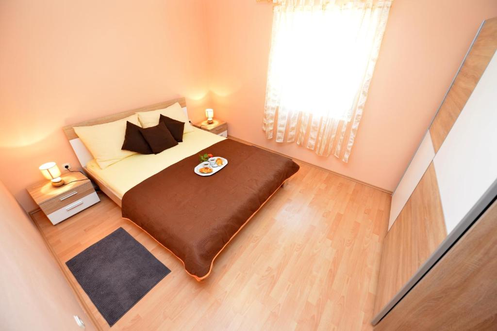 Posteľ alebo postele v izbe v ubytovaní Apartment Kokic