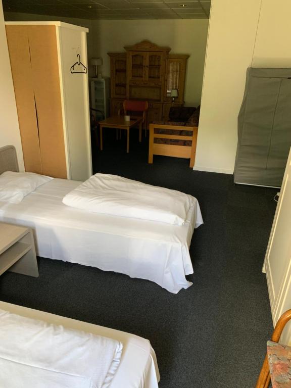 Postel nebo postele na pokoji v ubytování Skuldelev kro