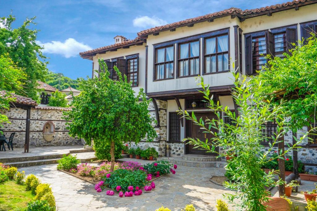 a house with a garden in front of it at Pachilov House in Zlatograd