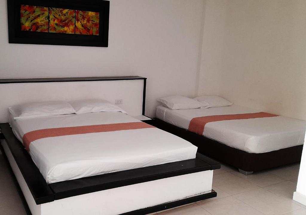 Postel nebo postele na pokoji v ubytování Apartamentos Las Piloneras