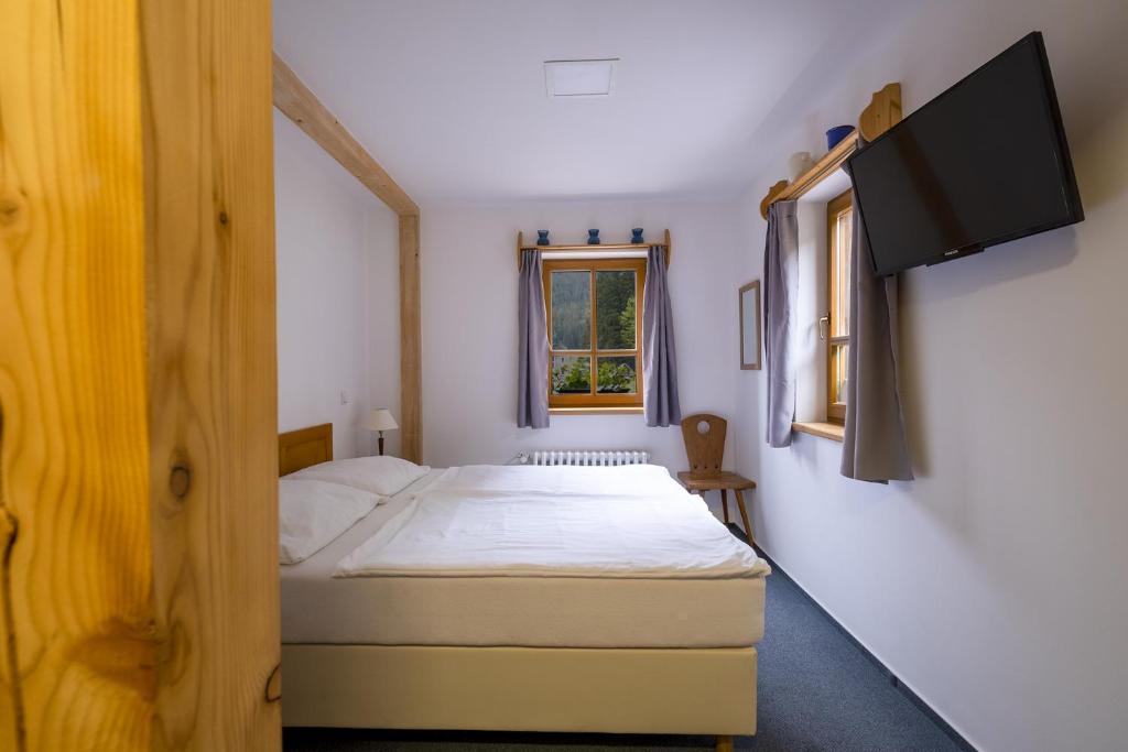 Postel nebo postele na pokoji v ubytování Hotel Hvezda