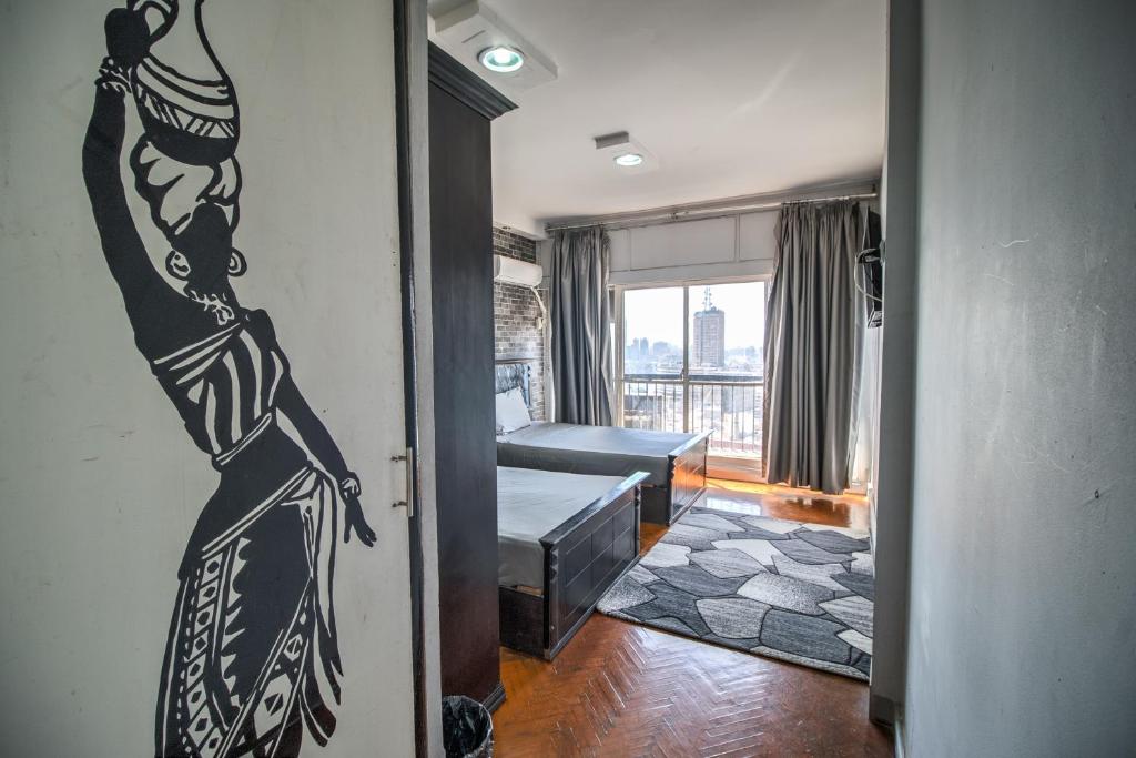 Postel nebo postele na pokoji v ubytování Castle Hostel