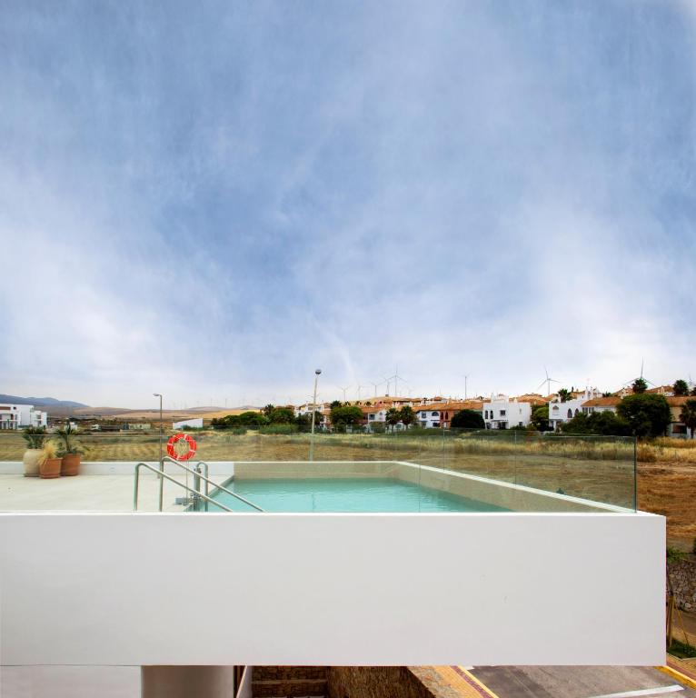a swimming pool in the middle of a building at Hotel Porfirio Picota - Adults Recommended in Zahara de los Atunes