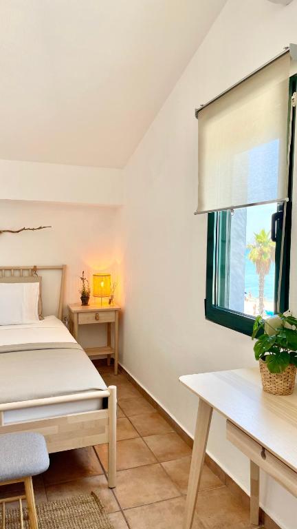 Posteľ alebo postele v izbe v ubytovaní Seafront Maisonette
