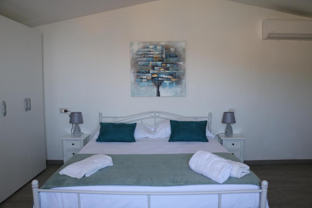 Uma cama ou camas num quarto em Albergo"Villa Biscotti"