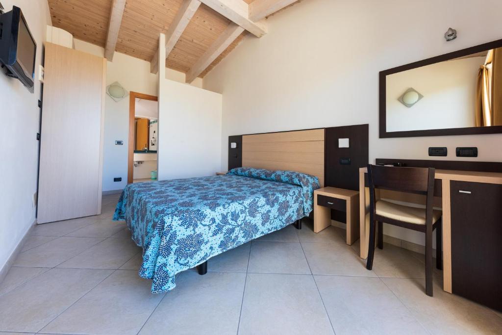 A bed or beds in a room at Residence Renadoro