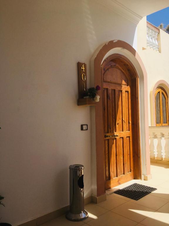 a door of a building with a trash can next to it at Villa 22 in Dahab