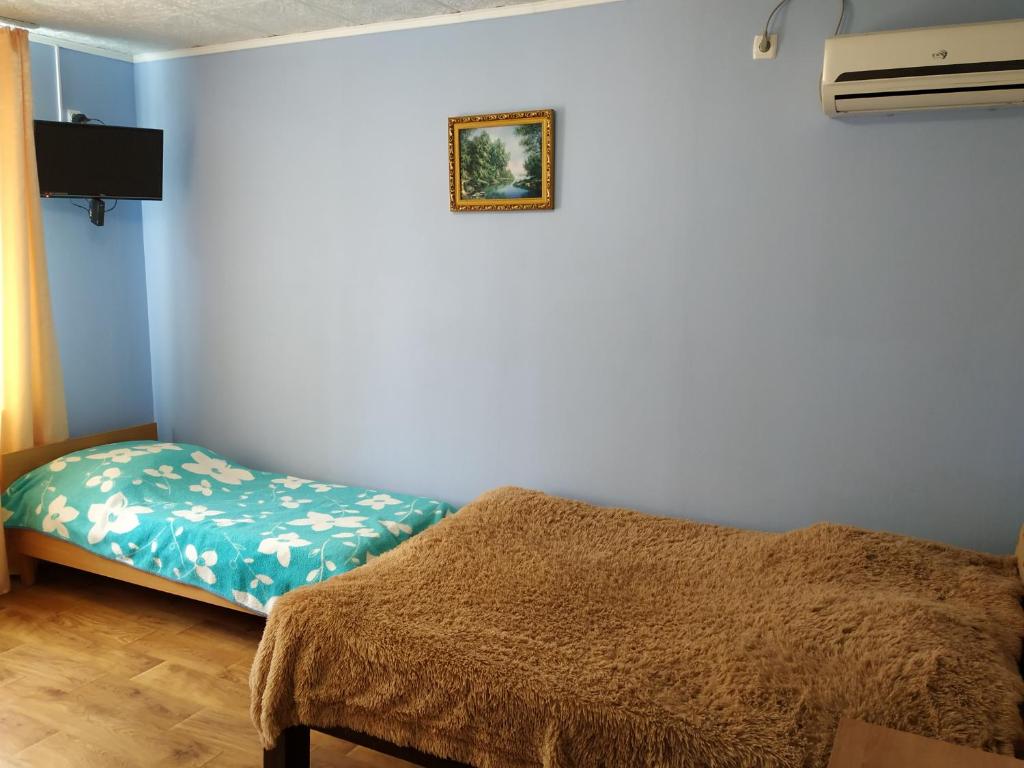 Llit o llits en una habitació de Guesthouse on Koroleva 15A