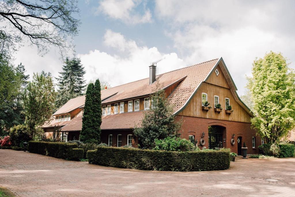 a large brick house with a brown roof at Ferienhof Werner in Emstek