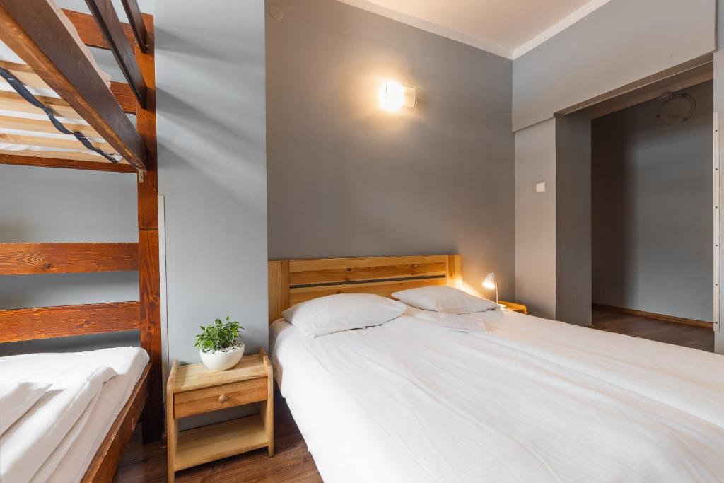 Posteľ alebo postele v izbe v ubytovaní Top Hostel Pokoje Gościnne