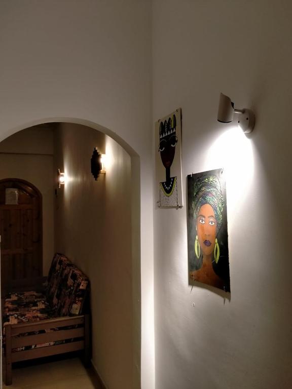 a room with a painting on the wall and a bed at Villa 22 in Dahab