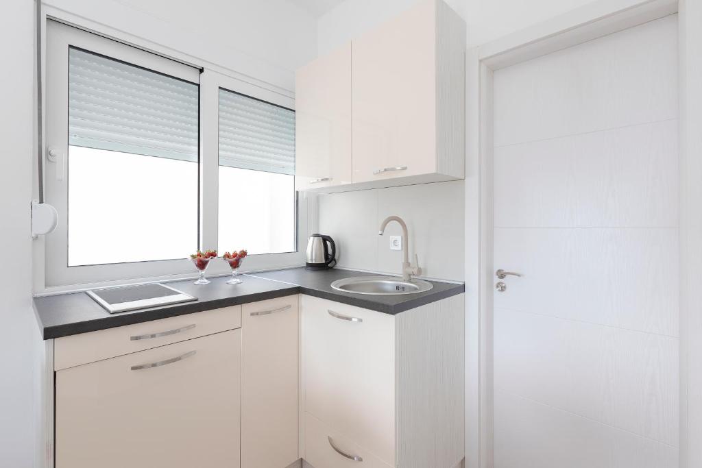 A cozinha ou kitchenette de Apartments Stetonn