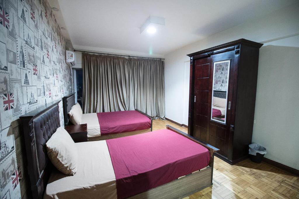 Postel nebo postele na pokoji v ubytování Castle Hostel