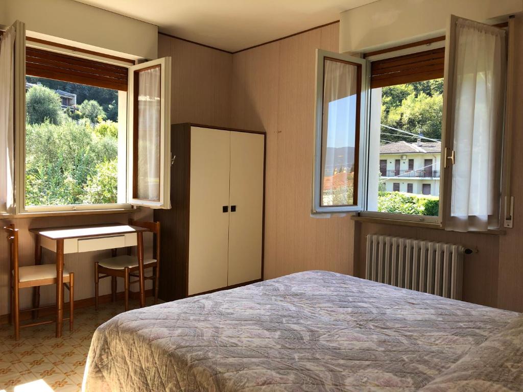 Postel nebo postele na pokoji v ubytování Hotel Zanetti