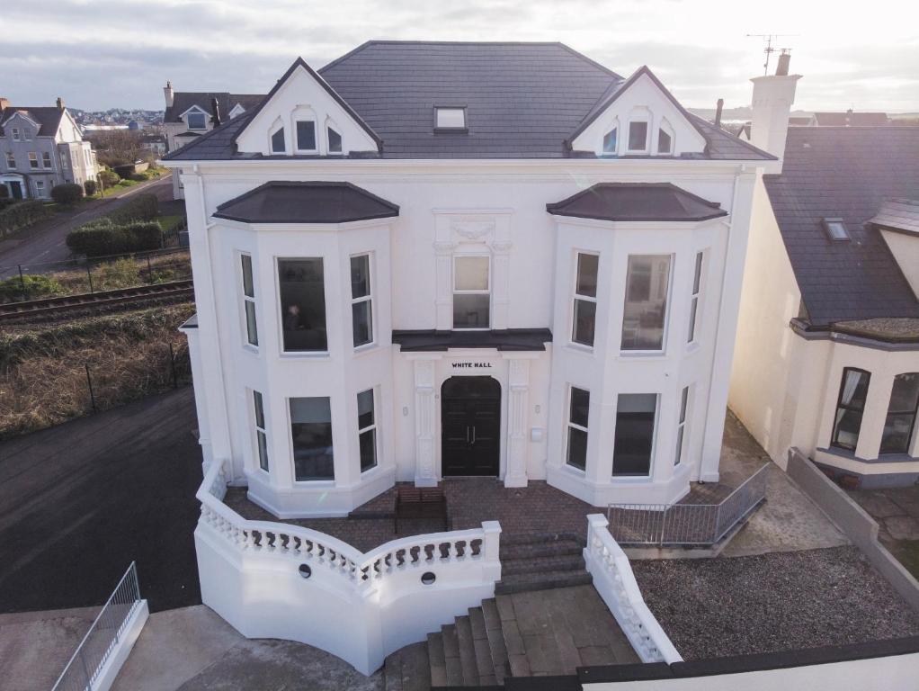 an aerial view of a white house at White Hall Portrush in Portrush