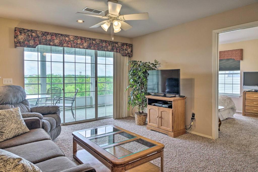 a living room with a couch and a tv at Champions Retreat Branson Condo with Balcony! in Branson