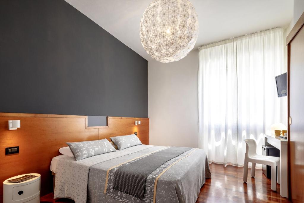 Postel nebo postele na pokoji v ubytování Euro Hotel