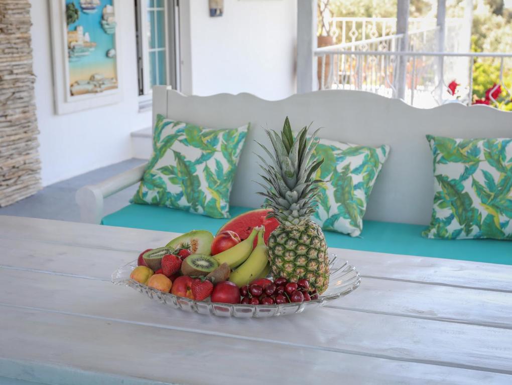 a bowl of fruit sitting on a table at Georgia Villas in Skiathos