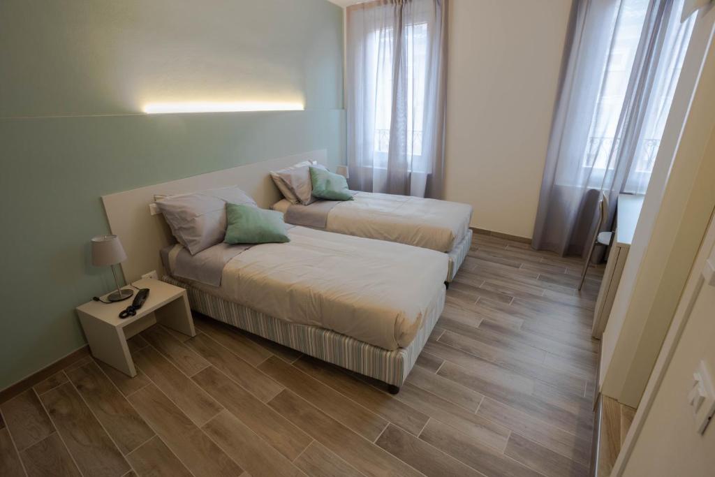 A bed or beds in a room at Hotel Cavallo Bianco