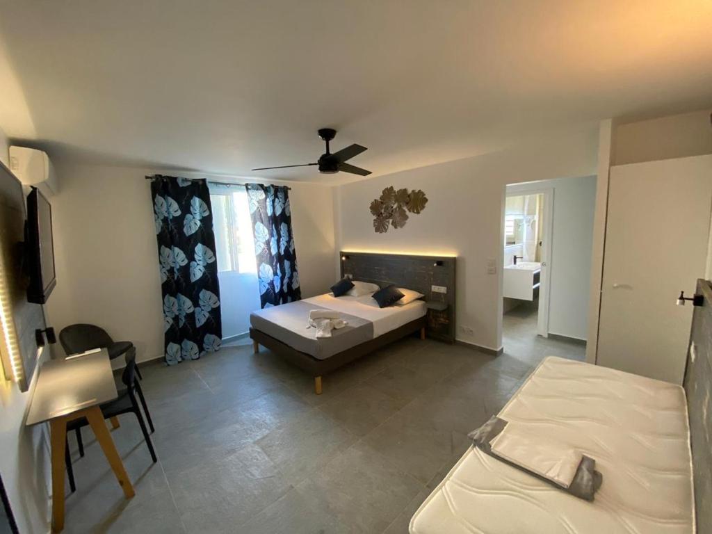 Postel nebo postele na pokoji v ubytování Karaibes Residence